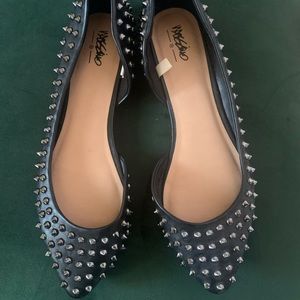 Black pointed toe flats with gunmetal studs. Size 8.5. Brand new, never worn.